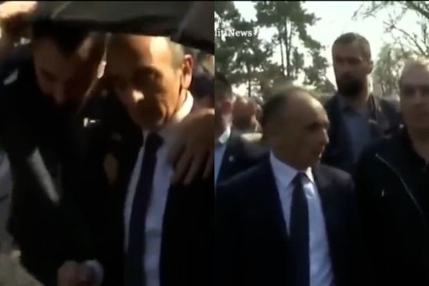 Parisdə prezidentliyə namizədə butulka atılıb Parisdə prezidentliyə namizədə butulka atılıb